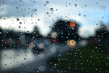 raindrop on windshield, car drive in rainy day weather