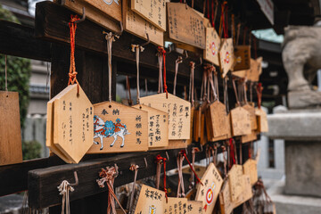Wooden boards on which wishes are written at Japanese shrines.