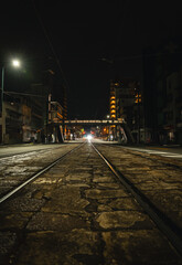 Midnight on a train track in a road in Hiroshima.