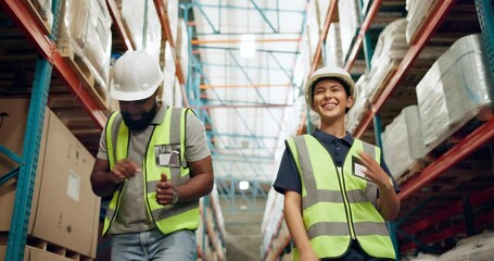 Warehouse, man and woman with celebration, dancing and cooperation with happiness or excited. Factory, inspection or employees with energy, factory or quality assurance with promotion or supply chain