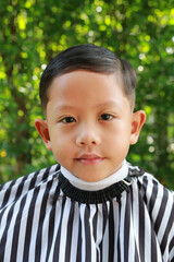 Asian boy cut in haircut in the garden, fashion haircut for a guy. - 761951139