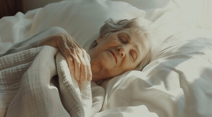 Peaceful senior woman sleeping on white bed with blanket, copy space available for text