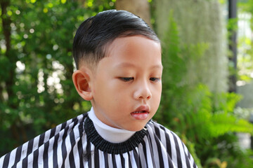 Asian little boy with fashion haircut for a guy. - 761951190