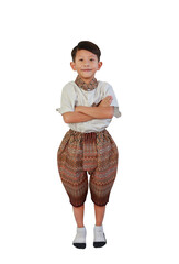 Asian boy age about 7 years old wearing traditional Thai dress standing and cross arms over chest isolated on white background. Image full length with clipping path. - 761952301