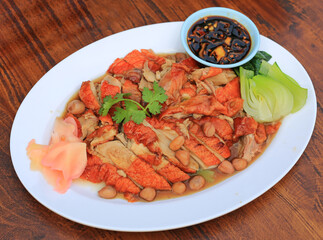 Sliced roasted duck served with sauce, bean and pickled ginger and vegetable on wood table background. - 761952710