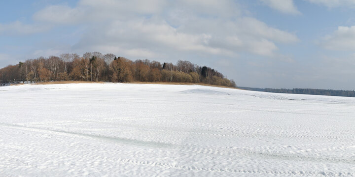 Winter fishing on the lake, beautiful panorama.