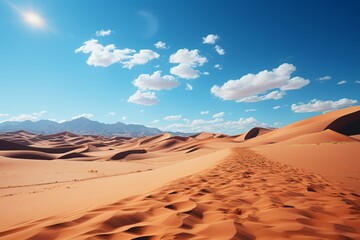 Fototapeta na wymiar Desert landscape with sand dunes, mountains, and a cloudy sky
