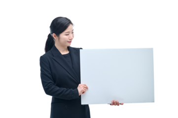 A beautiful Asian woman in a business suit is holding a white board and making various expressions and gestures.
