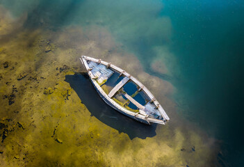 Aerial view of a small fishing boat on a lake in Poland