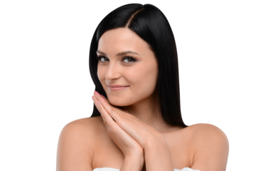 Close-up of a smiling woman with black hair, hands folded under her chin, on a white background. Portrait and lifestyle concept