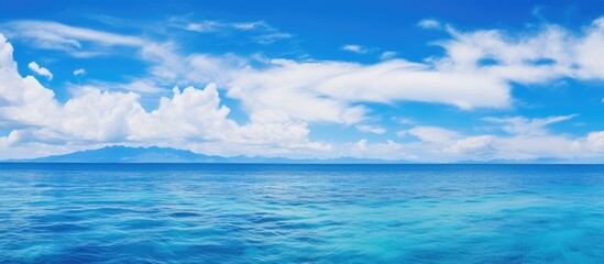 Obraz premium Tranquil Boat Ride on the Ocean with a Diverse View of the Sea and Sky