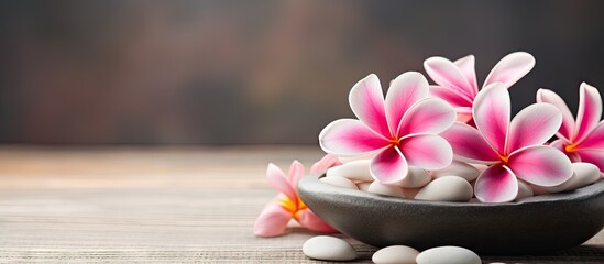 Spa setting with white flowers and smooth stones