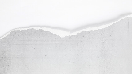 A close view revealing the texture and fibers of a torn copier paper edge.