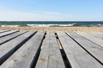 Fototapeta premium Wooden decking on the beach. Beautiful natural wallpaper. 