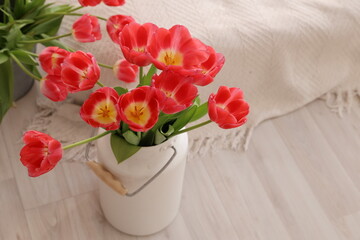 tulips in white jug