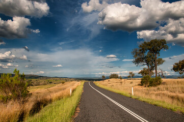 Journeying through the picturesque countryside of South East Queensland, Australia, revealing rolling hills, quaint towns, and lush farmland.