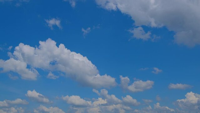 Blue sky with fluffy cloud time lapse on a sunny day 4k footage.