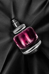 Perfume on black silk