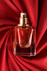 Perfume on draped fabric