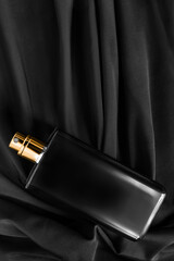 Perfume on black fabric