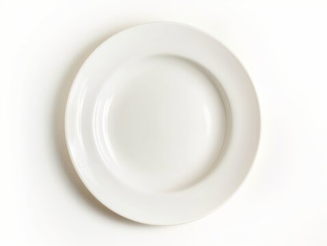 Top view of a clean white plate centered on a pure white background, symbolizing simplicity and minimalism.