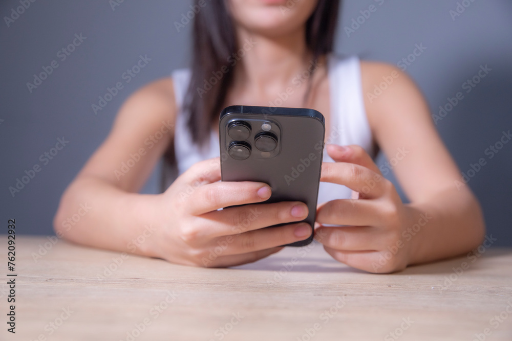 Wall mural close up of woman hands holding smartphone. woman use phone