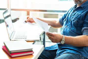 Architect working at his laptop on the office