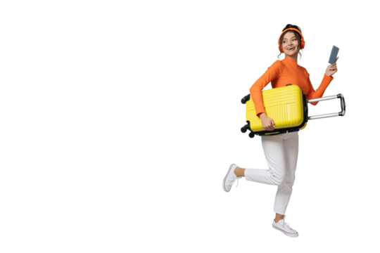 PNG,A young girl in headphones and with a yellow suitcase, isolated on white background