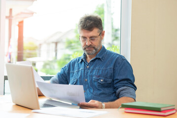 Architect working at his laptop on the office