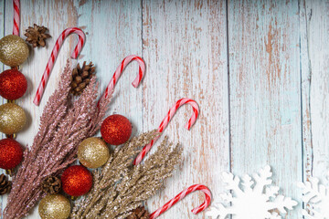 Christmas sugar canes, pinecons on a  wooden background with copyspace. Topview