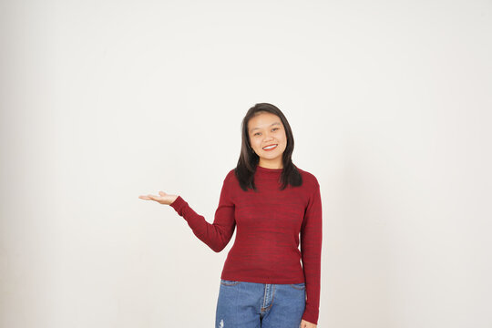 Young Asian woman in Red t-shirt Showing and holding on open palm copy space isolated on white background