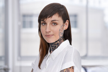 Business, woman and tattoo with portrait in office with confident attitude, serious and pride with...