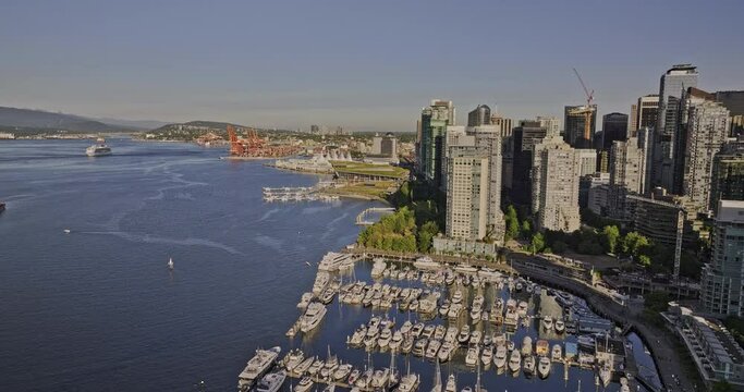 Vancouver BC Canada Aerial v43 drone fly along waterfront promenade capturing harbour views downtown cityscape, bayshore marina and Eastside shipyard - Shot with Mavic 3 Pro Cine - July 2023