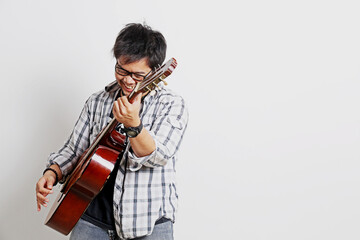 a guitarist playing acoustic guitar with a white background