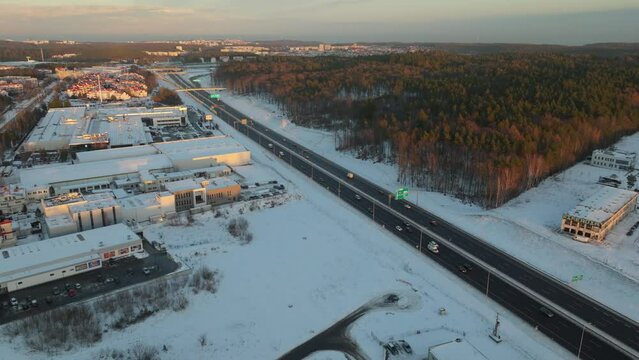 Aerial View Of Vehicles Driving Through Highway During Winter In Dabrowa, Poland.