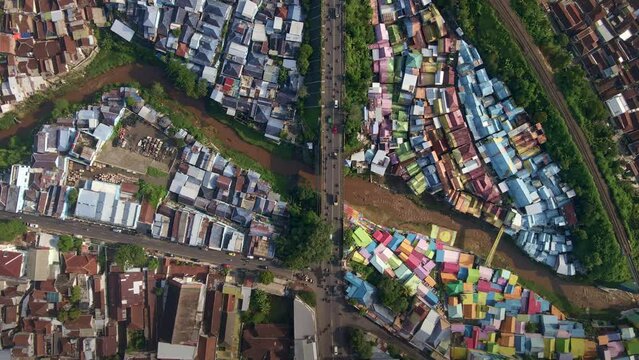Urban Pulse: Life at the Crossroads - Exploring Malang's Slum Tourism Epicenter, aerial 4k drone footage