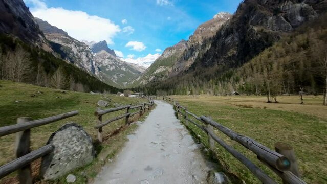 Crazy FPV drones racing along country path in Val di Mello in Northern Italy
