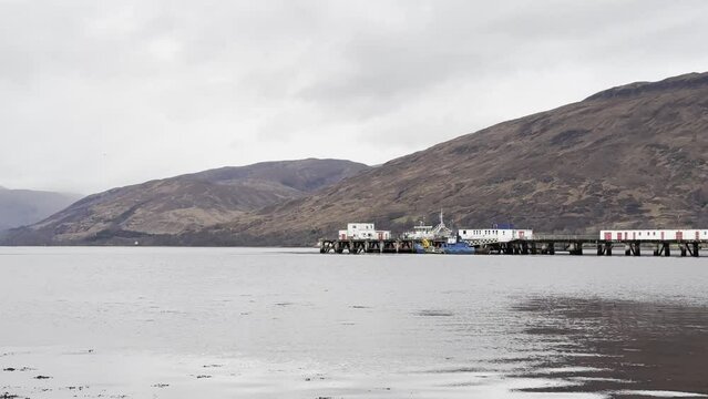 Calm cloudy day on Loch Eil, Fort William with The Pier in the foreground