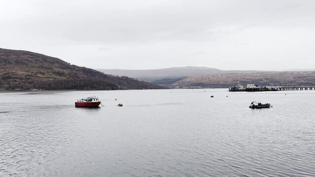 Fishing boats anchored in Loch Eil, Fort William on a cloudy spring day