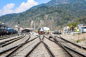 View of train Railway Tracks from the middle during daytime at Kathgodam railway station in India, Train railway track view, Indian Railway junction, Heavy industry