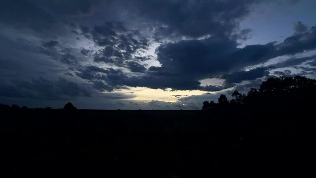 Timelapse dramatic sky with storm clouds in African nature landscape