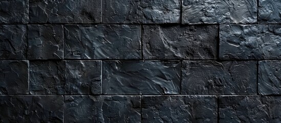 Black brick wall texture with block pattern for product display or montage.