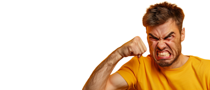Portrait of a man punching himself in the face with his fist. In yellow T-shirt.