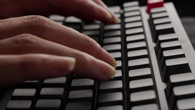 Fingers Typing On Grey Mechanical Keyboard Of Computer, Close Up Aside Shot