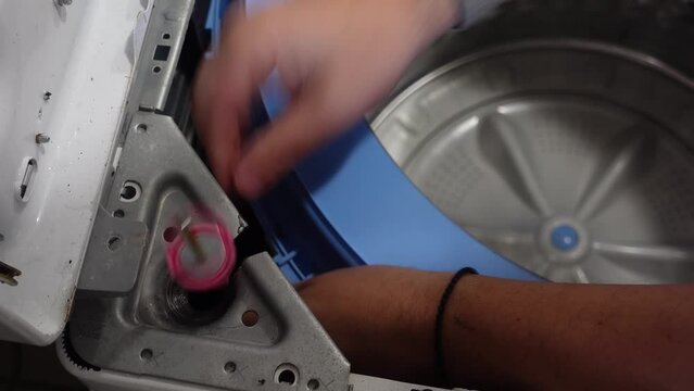 Replacing the shock absorber on a top load washing machine