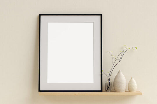 Framed poster mockup on the shelf with interior decor