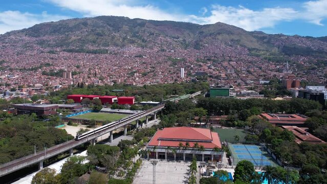 Medellin, Colombia. Aerial View of Metro Train Passing Parque Explora, Botanical Garden and University of Antioquia Campus