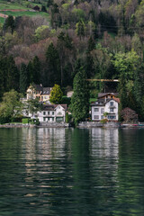 Fototapeta premium Waterview on Swiss village, house or castle near Lucerne, Switzerland.