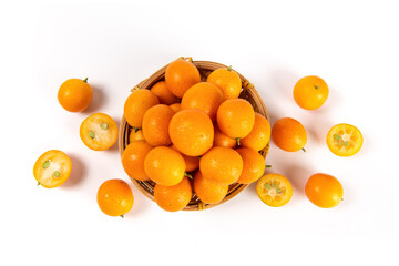 ripe cumquat or kumquat fruit with half isolated on white background