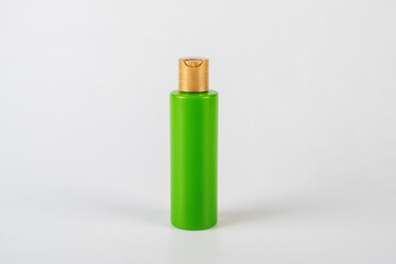 Green shampoo bottle isolated on white background